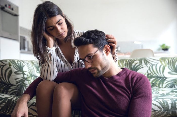 young couple at home dealing with anxiety