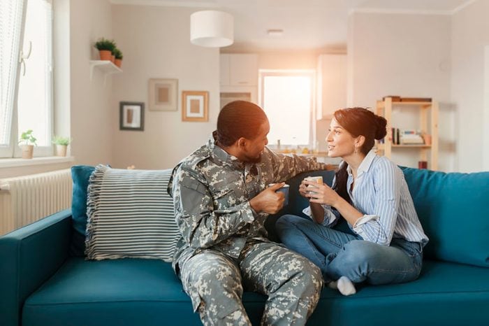 woman and military man couple talking at home good listener