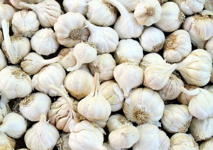 close up of group of whole garlic cloves