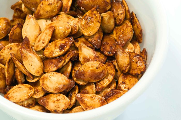 roasted pumpkin seeds in a white bowl