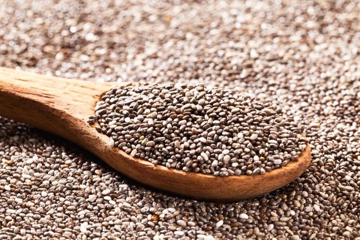 dried chia seeds with a wooden spoonful