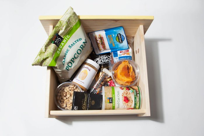 Box of healthy office snacks to keep at your desk.