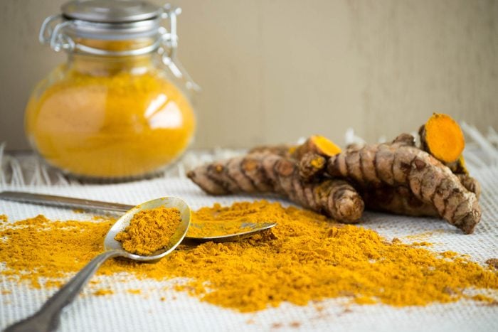 turmeric root, powder, and in a jar
