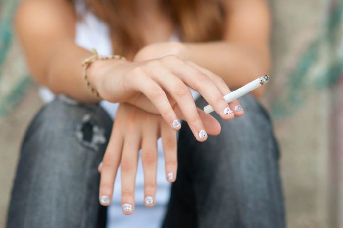 woman holding a cigarette