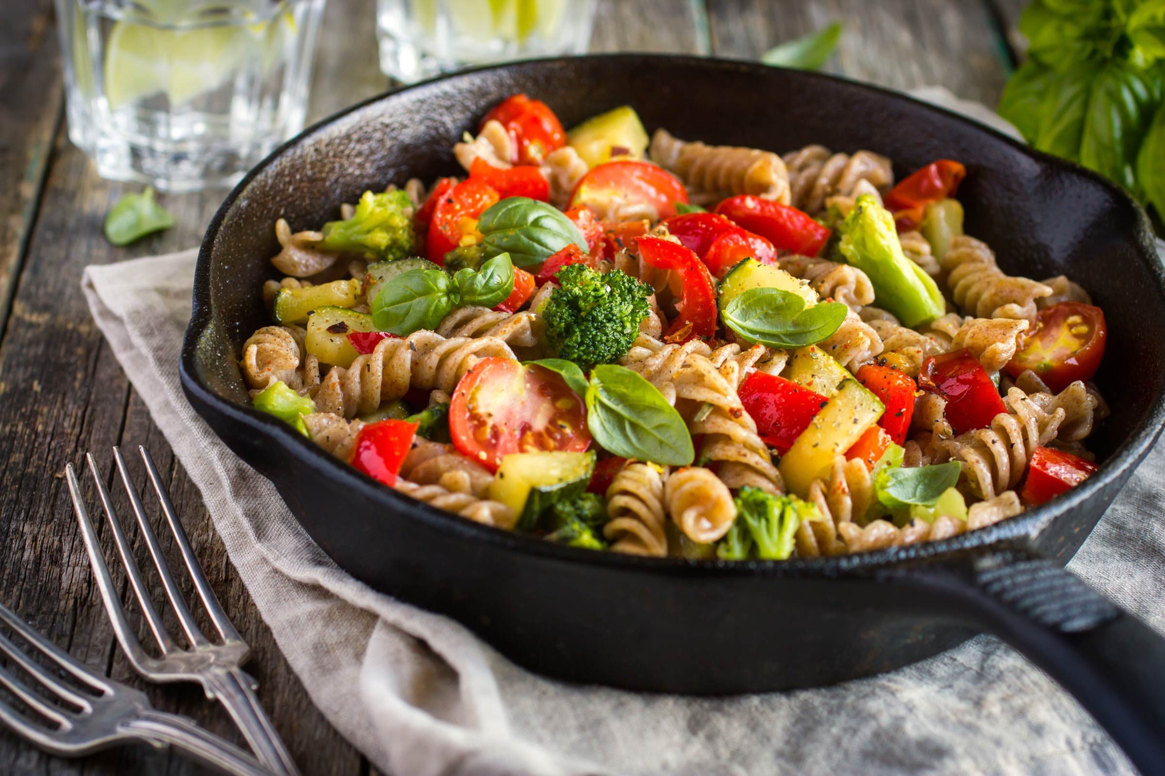 cast iron skillet of pasta and vegetables