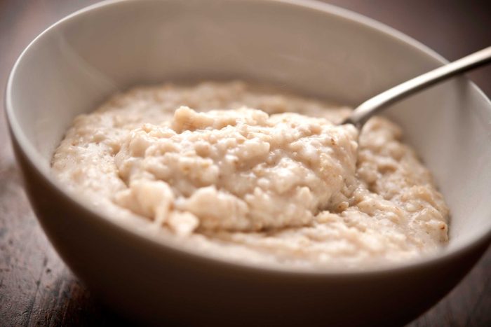 bowl of cooked oatmeal with spoon