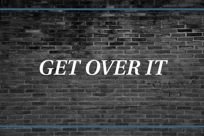 Brick wall background that says: Get over it.