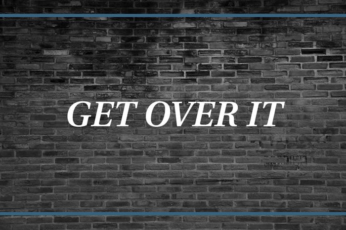 Brick wall background that says: Get over it.