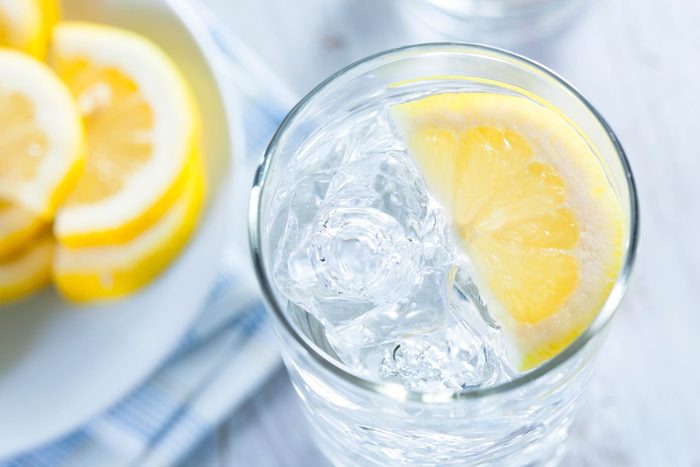 glass of lemon water with ice