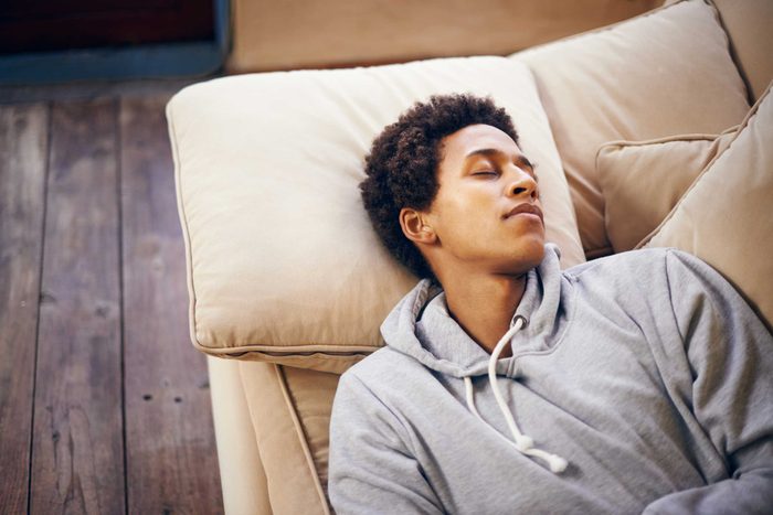 Black man napping on the couch