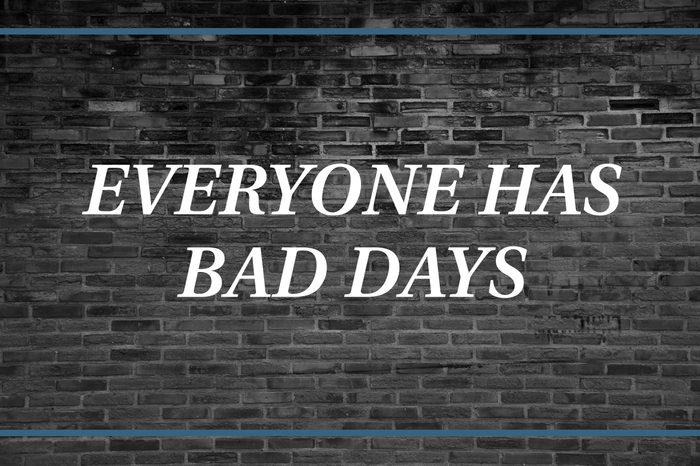 Brick wall background that says: Everyone has bad days.
