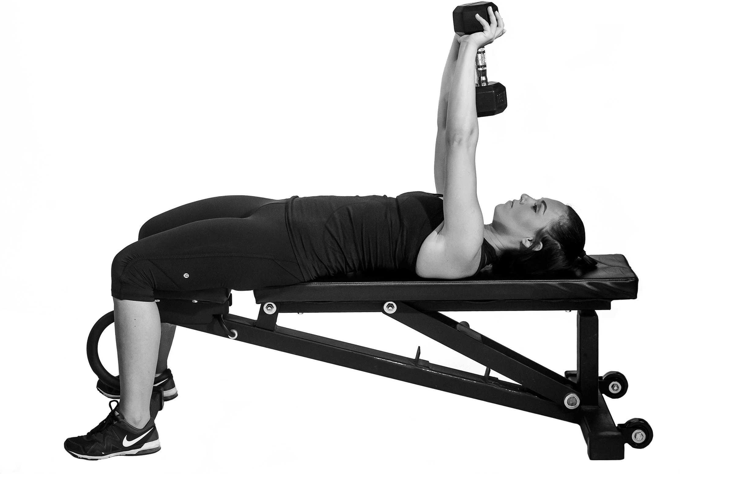 Woman doing dumbbell pullover.