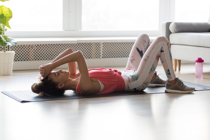 young woman tired during at home workout