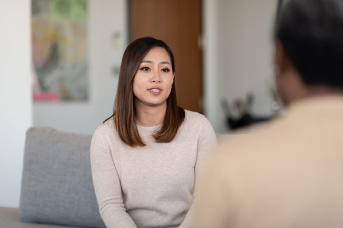 woman in therapy talking to therapist