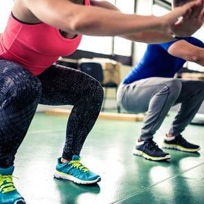 woman squatting exercise gym