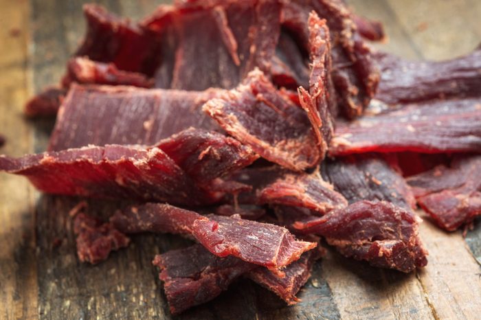 pile of jerky on a wooden table
