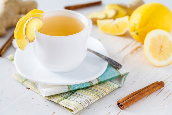 tea in a white tea cup with lemon slices