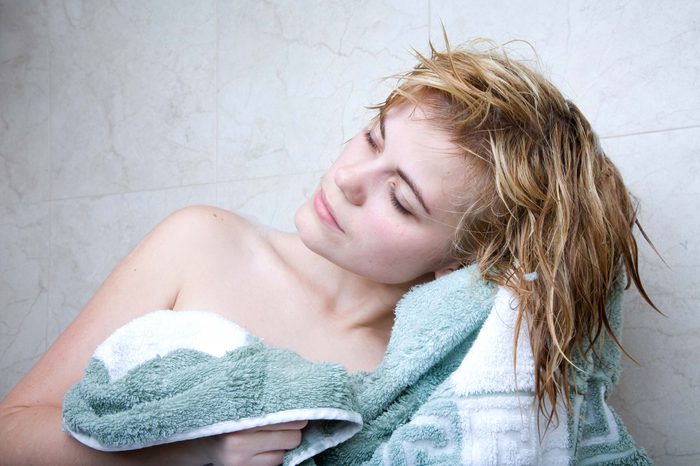 woman towel-drying hair