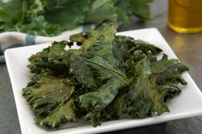 white square plate with kale chips