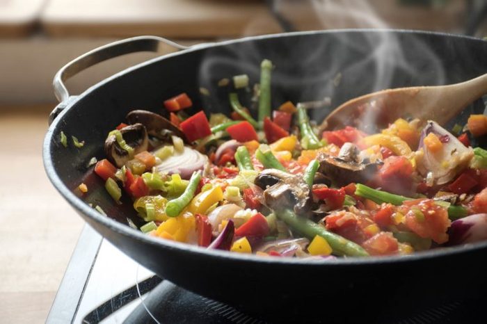 vegetable stir-fry cooking in a wok