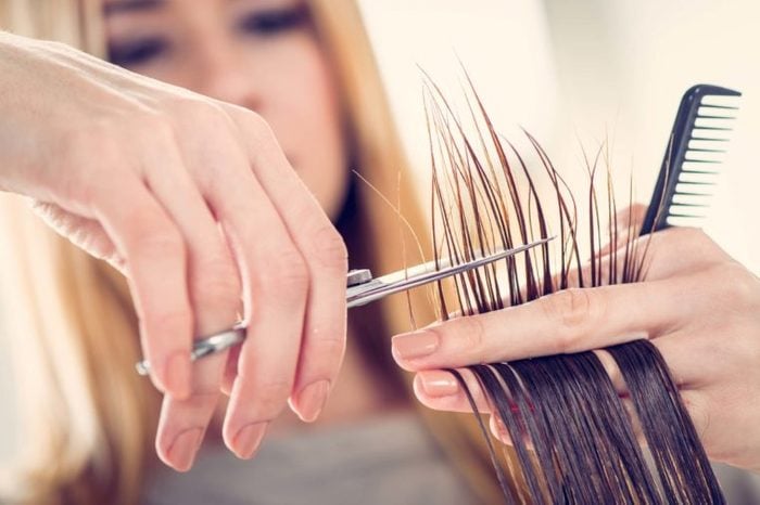 woman trimming hair