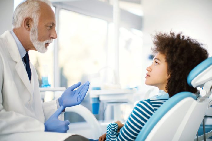 black woman dentist conversation procedure