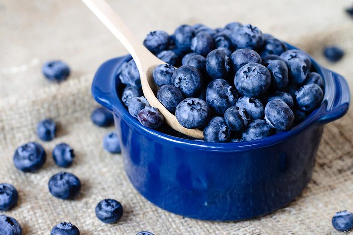 blueberries in a bowl with spoon