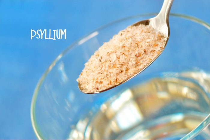 Spoonful of psyllium and a glass of water. 