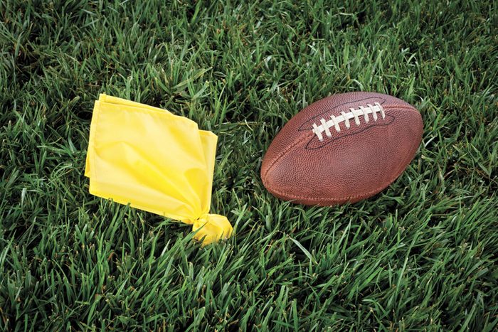 flag and football on grass