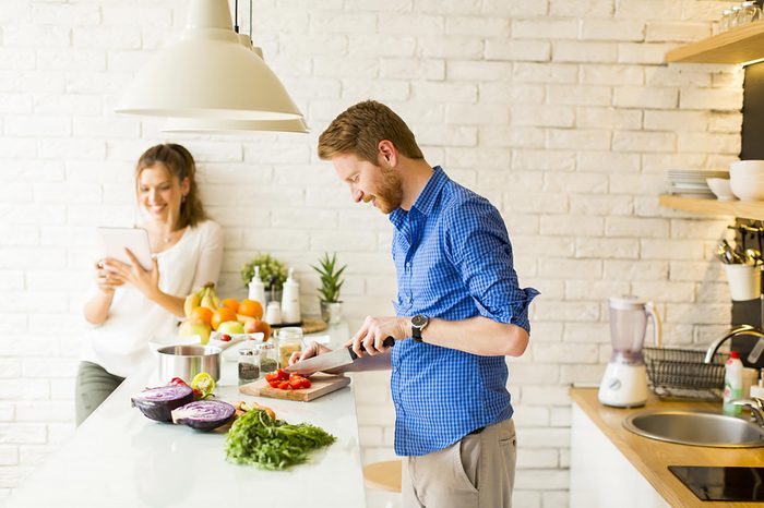 couple cooking healthy meal 