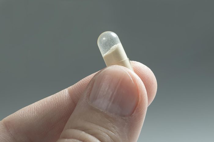 probiotic pill in hand