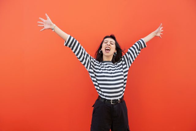 happy woman on red background
