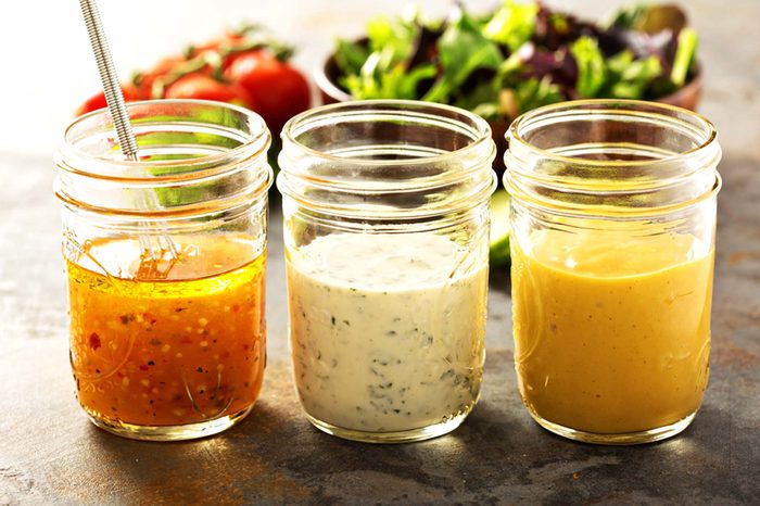 Three jars of different salad dressing