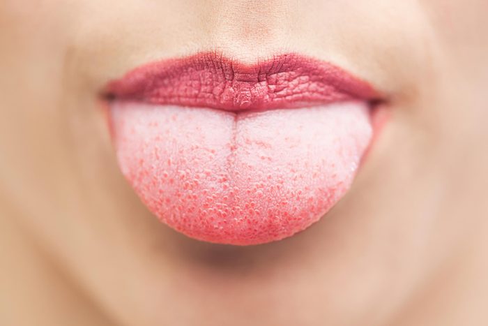 woman sticking out tongue