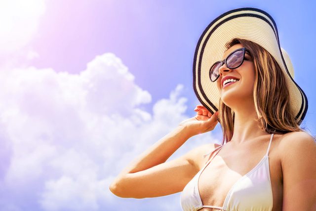 woman wearing sunhat outside