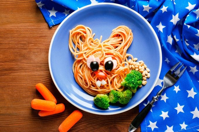 pasta swirled into bunny shape with edible face, broccoli, carrots