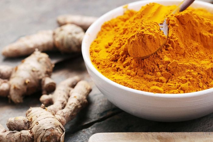 turmeric spice in a white bowl