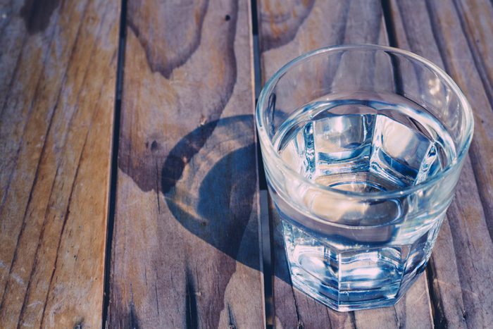 glass of water on wood surface