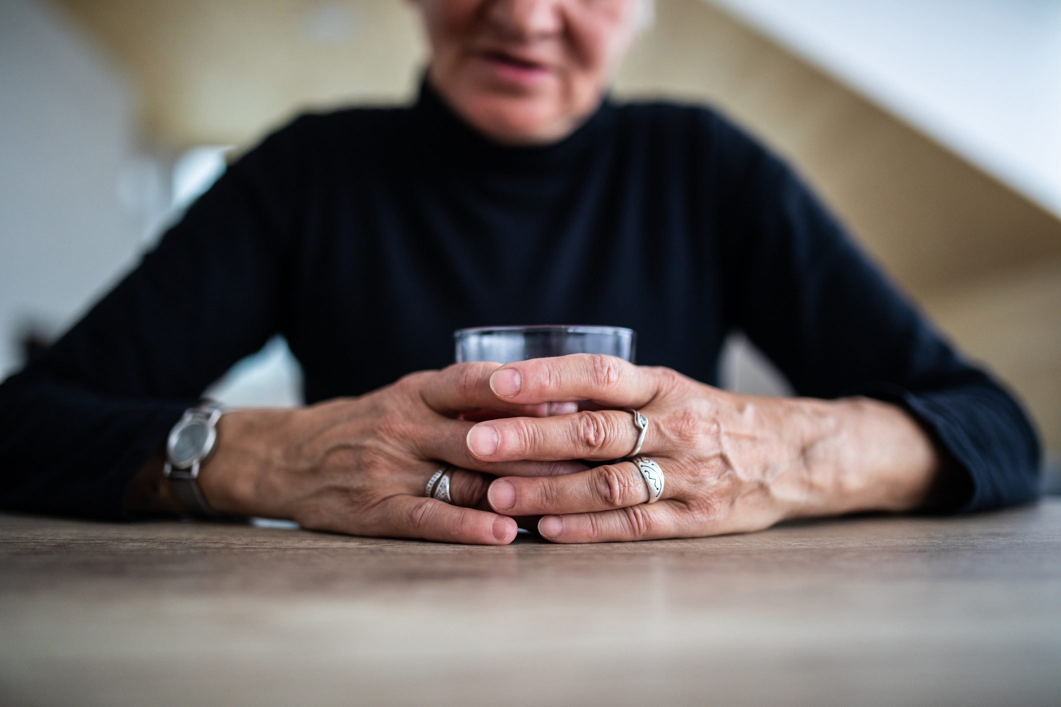 older woman struggling with alcohol addiction