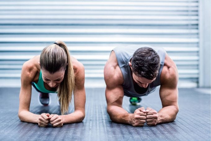 Man and woman working out together.