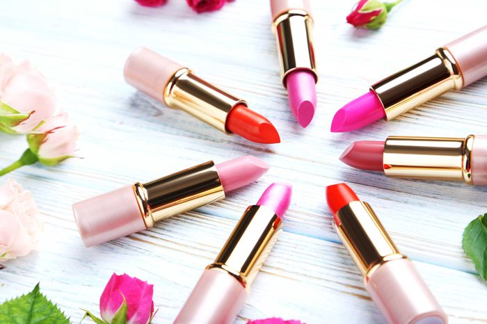 Six shades of open red and pink lipstick.