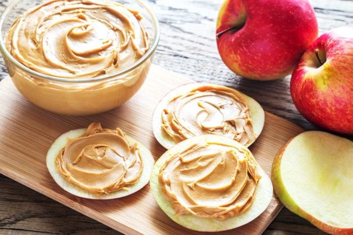 peanut butter spread on apple slices