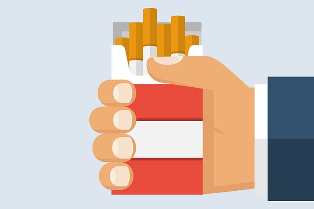 illustration of hand holding pack of cigarettes