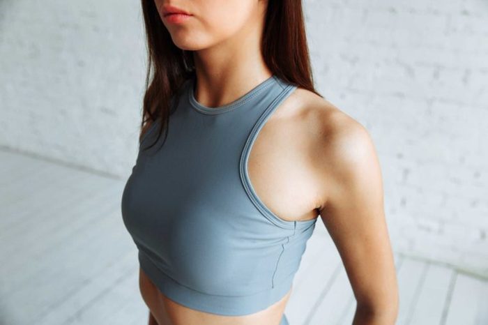 Young woman wearing a sports bra.