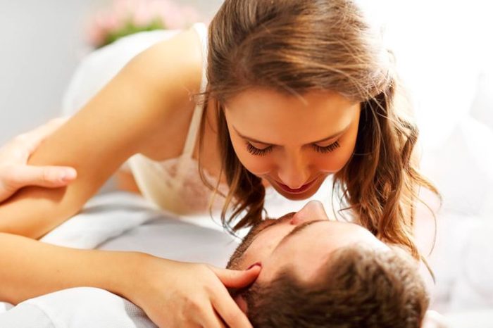 couple in intimate embrace while lying down