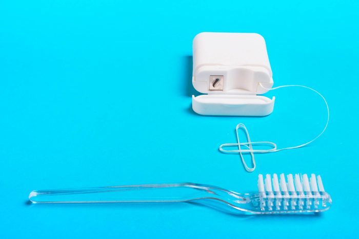 floss and toothbrush