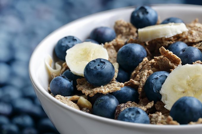 bowl of blueberries, bananas, and cereal