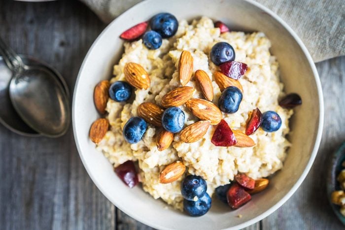 bowl of oatmeal with fruit and nuts