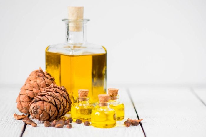 cedarwood pinecones and essential oil bottles