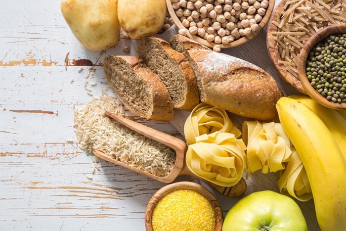 Bread, pasta, rice, corn meal and other carbs on a table